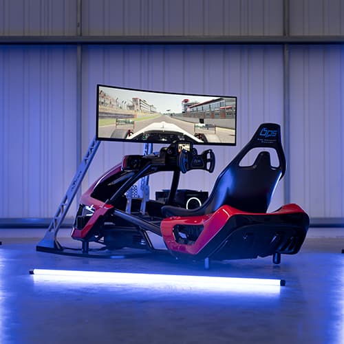 Red and black professional racing simulator rig with curved monitors