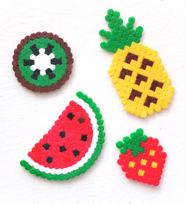 Finished perler bead pieces — kiwi, pineapple, watermelon and strawberry